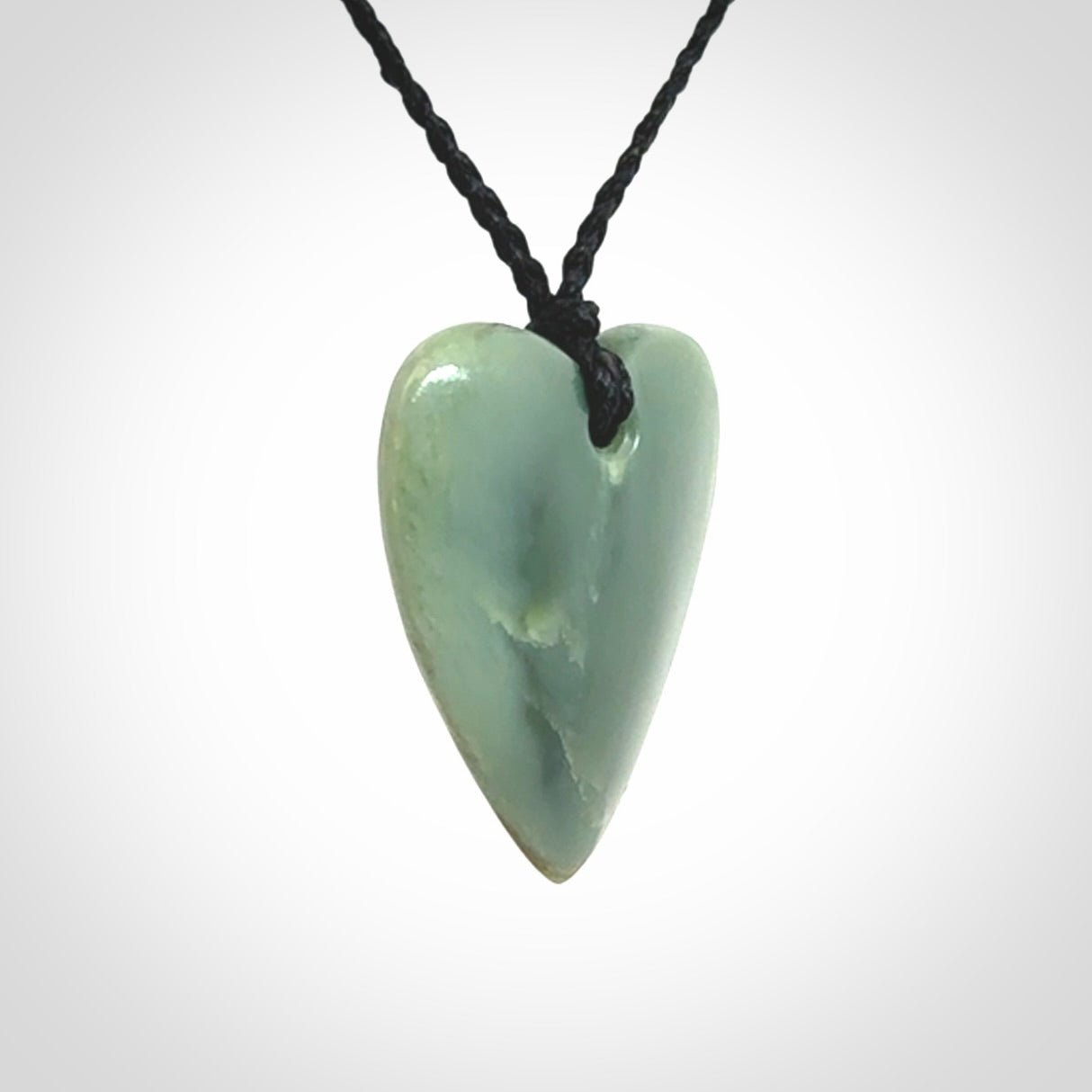 A hand carved small heart pendant made from New Zealand Inanga jade.