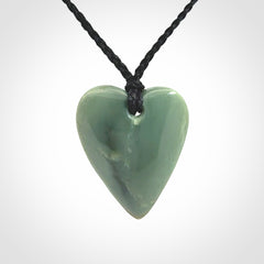A hand carved small heart pendant made from New Zealand Inanga jade.