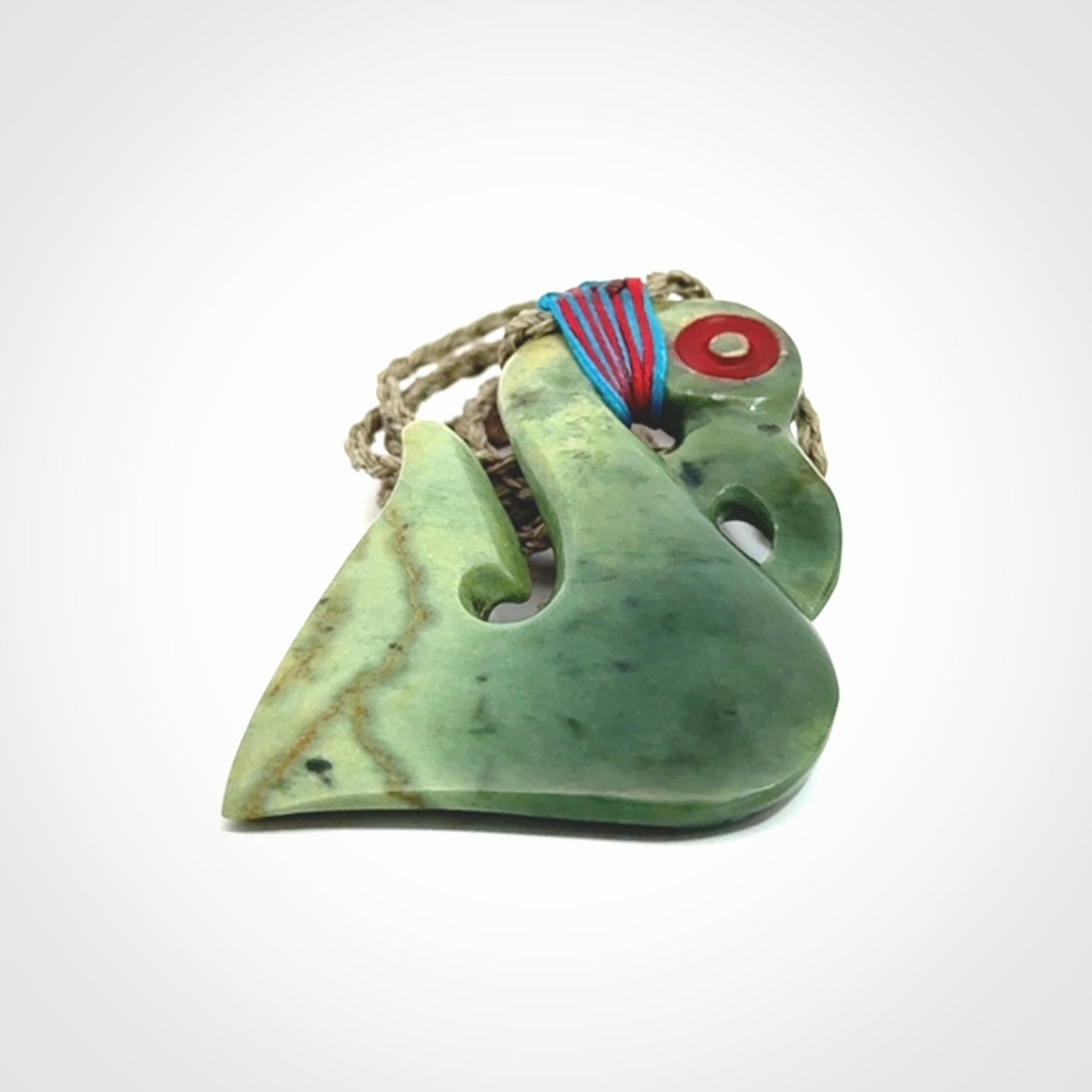 This picture shows a contemporary manaia with hook pendant. The cord colour is khaki and it is length adjustable. This is a very beautiful piece of art to wear.