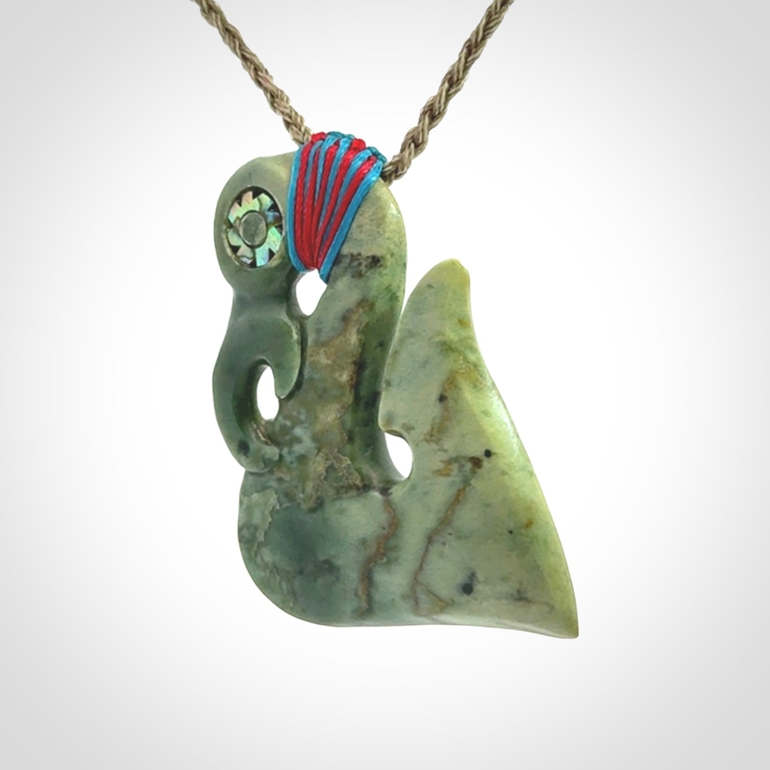 This picture shows a contemporary manaia with hook pendant. The cord colour is khaki and it is length adjustable. This is a very beautiful piece of art to wear.