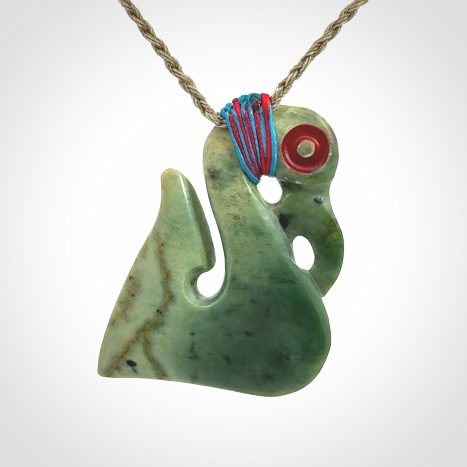 This picture shows a contemporary manaia with hook pendant. The cord colour is khaki and it is length adjustable. This is a very beautiful piece of art to wear.