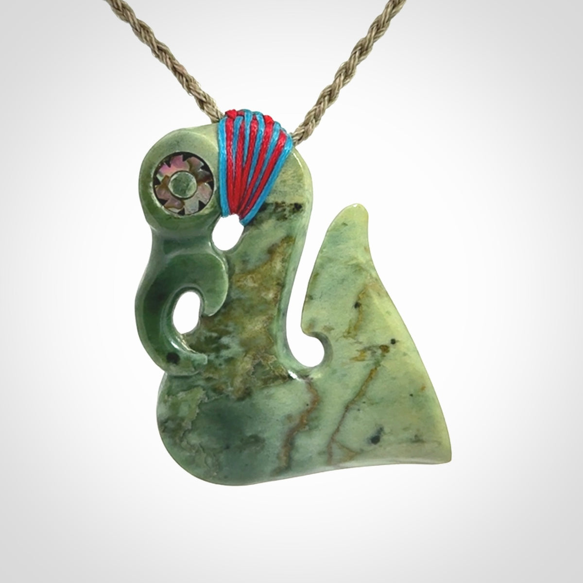 This picture shows a contemporary manaia with hook pendant. The cord colour is khaki and it is length adjustable. This is a very beautiful piece of art to wear.