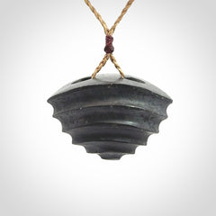 This picture shows a medium sized Onewa Stone contemporary drop pendant. A hand made unique and contemporary necklace hand carved here in New Zealand.