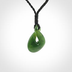 Single twist pendant. Hand carved from rare New Zealand jade this is a beautiful small pounamu pendant. The cord is length adjustable.