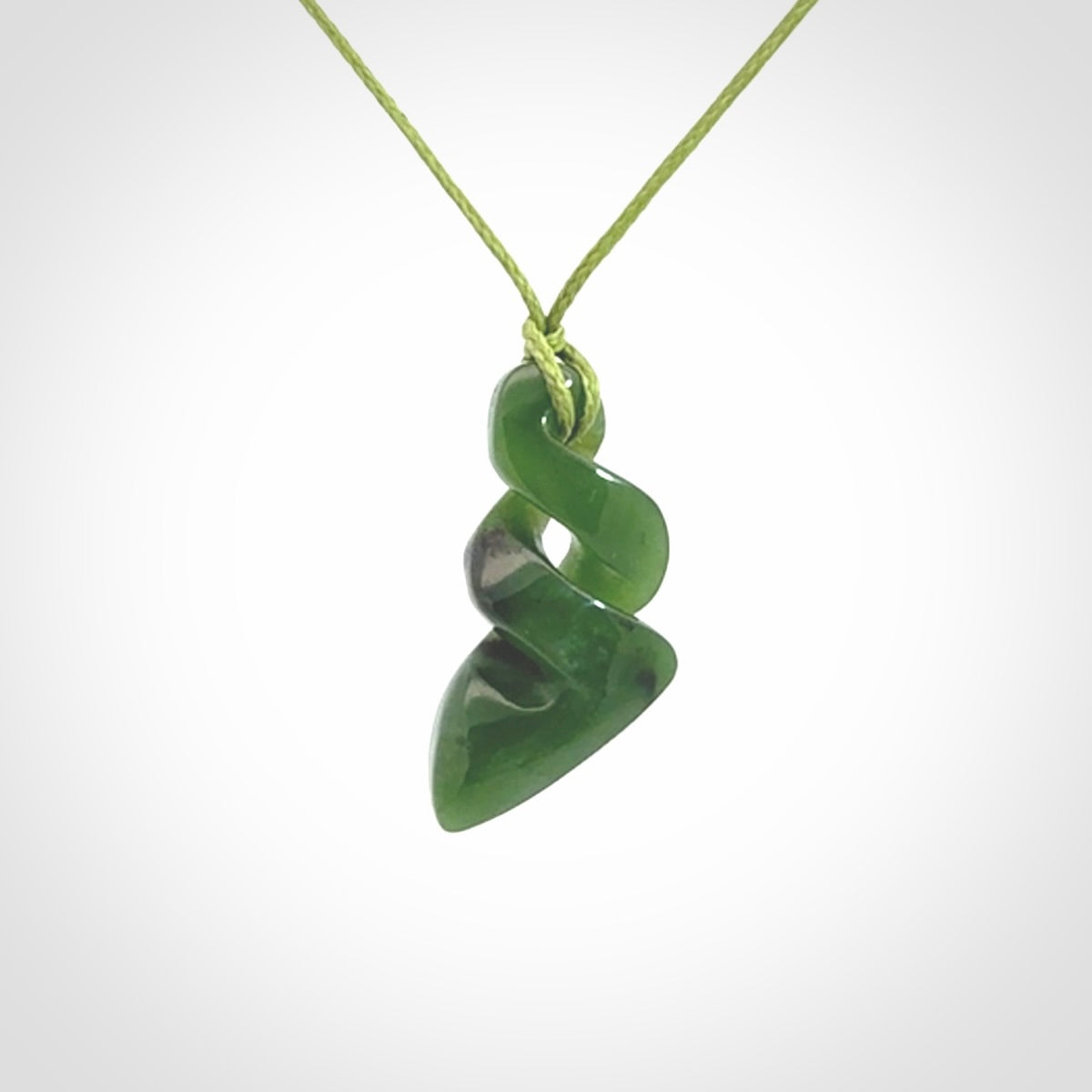 Hand carved small sized, New Zealand jade double twist pendant.