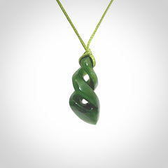 Hand carved small sized, New Zealand jade double twist pendant.