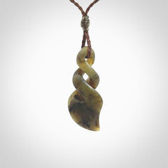 Hand carved small sized, New Zealand jade double twist pendant.