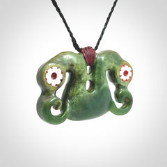Jade Pekapeka, double manaia, pendant hand made here in New Zealand. The cord is black is adjustable. Unique necklace for men and women. Pekapeka necklace hand made from New Zealand Jade with Pāua Shell and Mother of Pearl eyes.