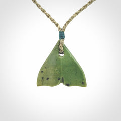 Hand carved small New Zealand Jade whale tail pendant.