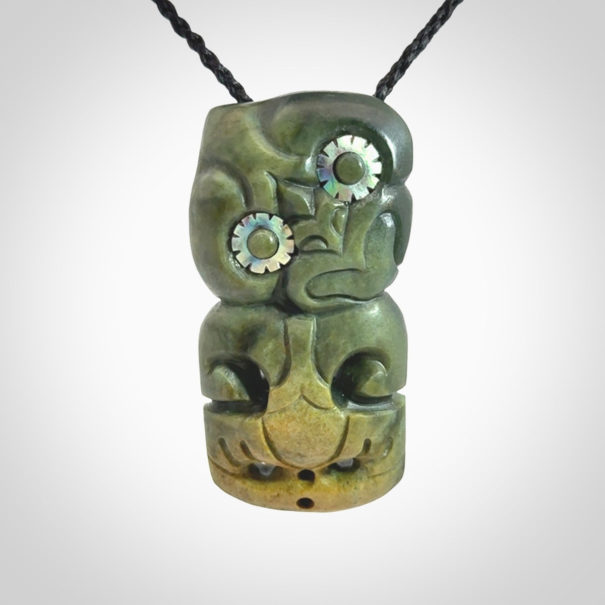 This is a medium sized tiki - carved from gorgeous New Zealand Marsden jade. The cord is an adjustable four plaited cord in black.