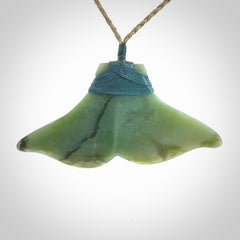 Hand carved New Zealand Jade whale tail pendant.