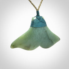 Hand carved New Zealand Jade whale tail pendant.
