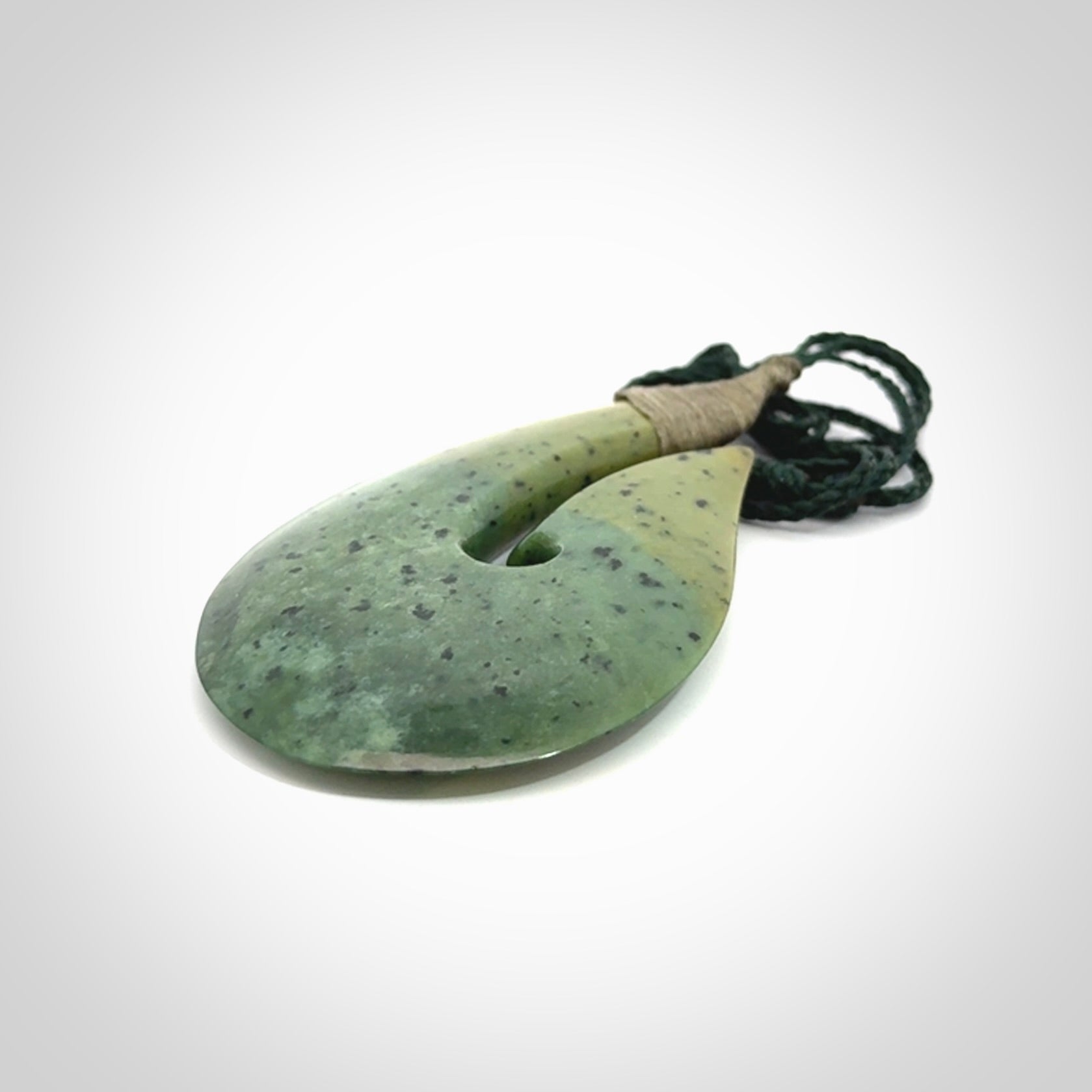 Hand carved New Zealand flower jade hook, matau pendant.