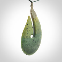 Hand carved New Zealand flower jade hook, matau pendant.