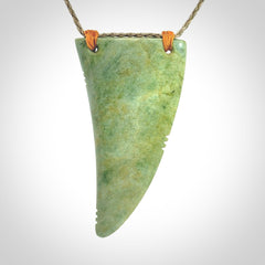 Hand carved New Zealand Flower jade Rei Puta pendant with four Koru engraving.