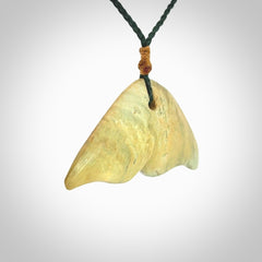 Hand carved New Zealand Jade whale tail pendant.