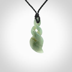 Hand carved small sized, New Zealand Inanga jade double twist pendant.
