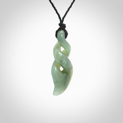 Hand carved small sized, New Zealand Inanga jade double twist pendant.