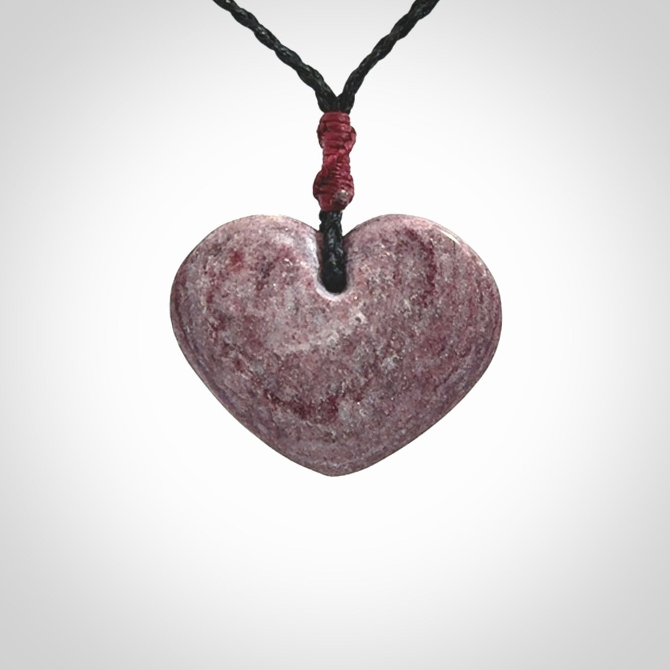 A hand carved heart pendant made from New Zealand Aroha Stone. This is a smaller sized and visually striking piece, beautifully curved and sensuous. The perfect piece of jewellery for someone you love.