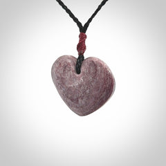 A hand carved heart pendant made from New Zealand Aroha Stone. This is a smaller sized and visually striking piece, beautifully curved and sensuous. The perfect piece of jewellery for someone you love.