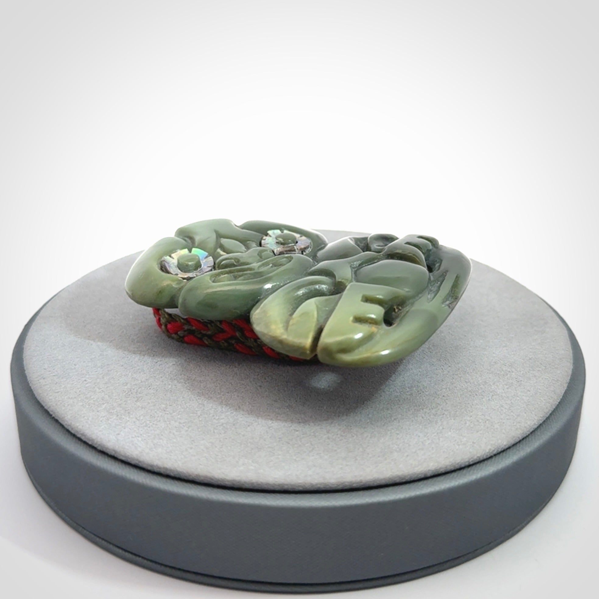 Hand carved New Zealand Jade tiki pendant