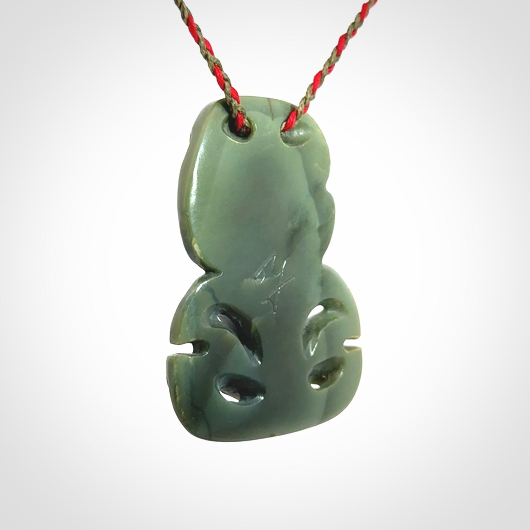 Hand carved New Zealand Jade tiki pendant