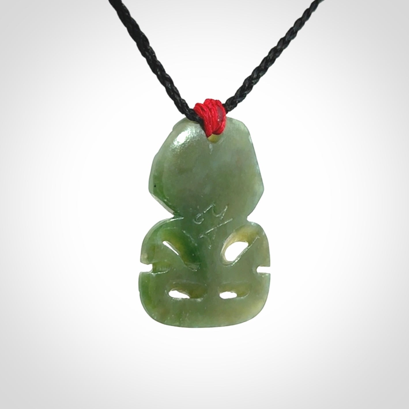 Hand carved New Zealand Jade tiki pendant