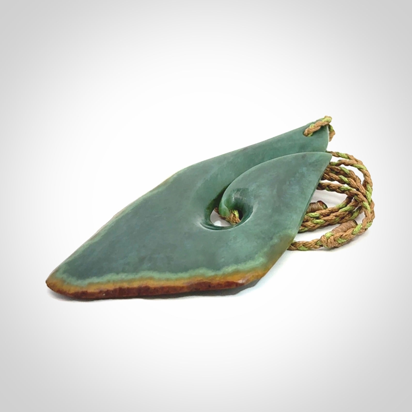 Hand carved New Zealand jade hook, matau pendant.