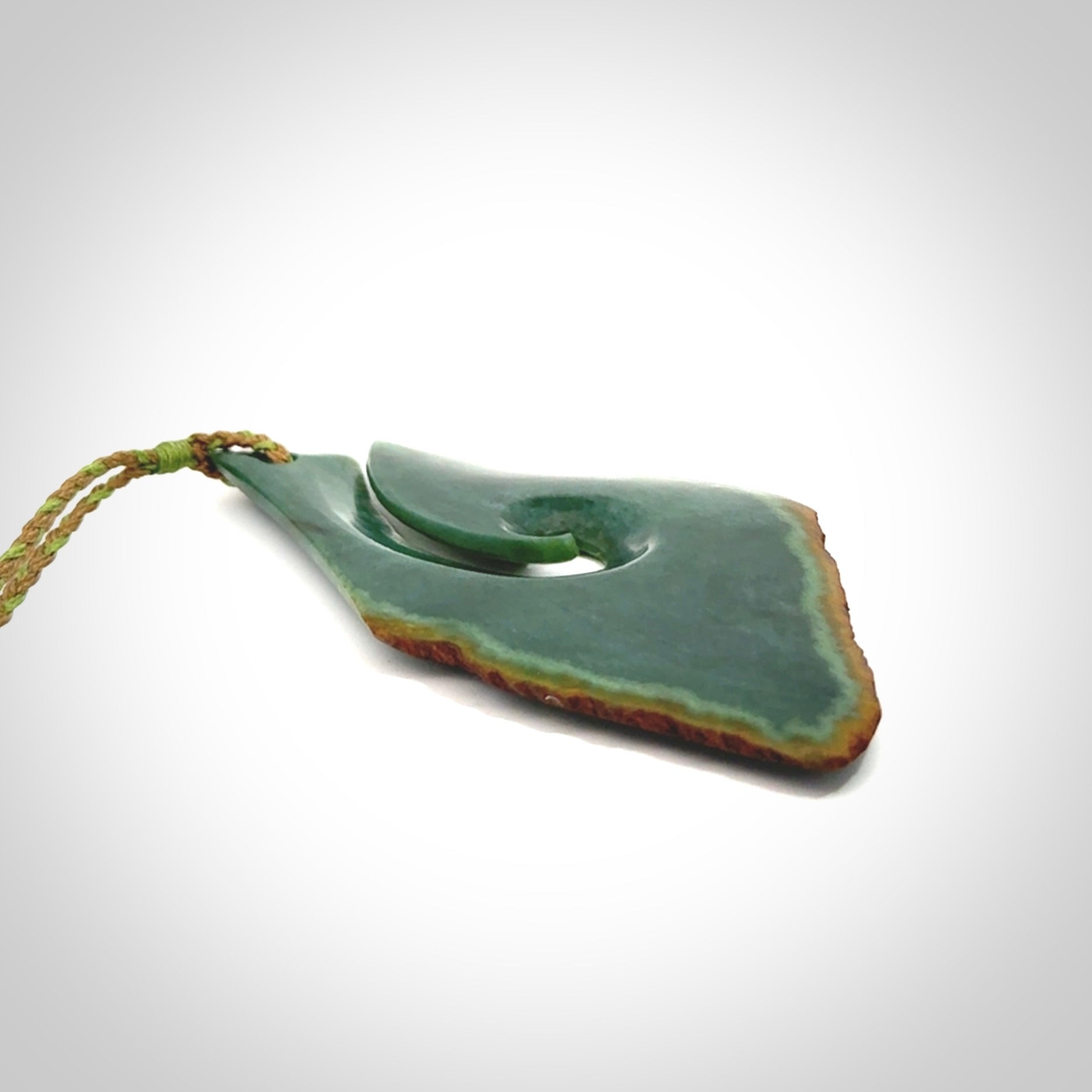 Hand carved New Zealand jade hook, matau pendant.