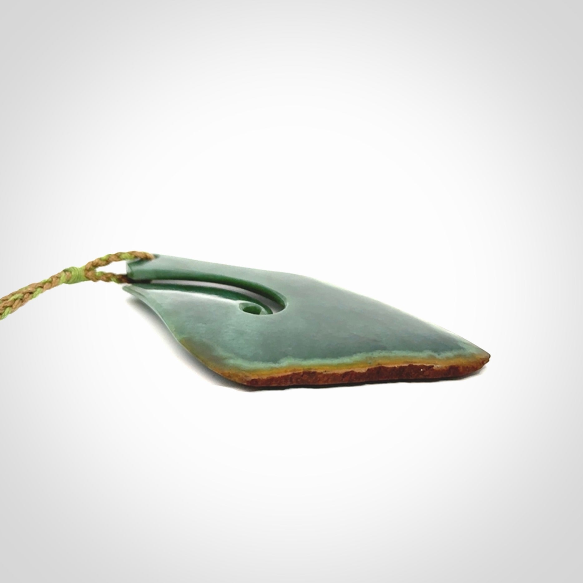 Hand carved New Zealand jade hook, matau pendant.