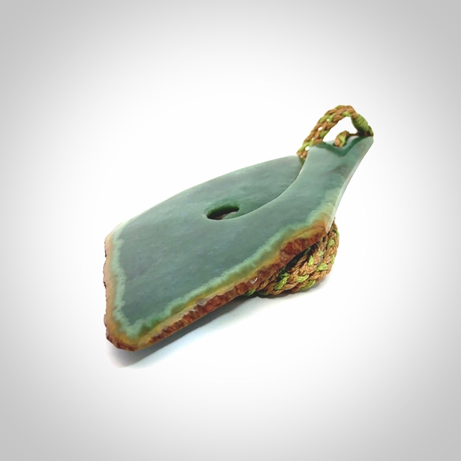 Hand carved New Zealand jade hook, matau pendant.