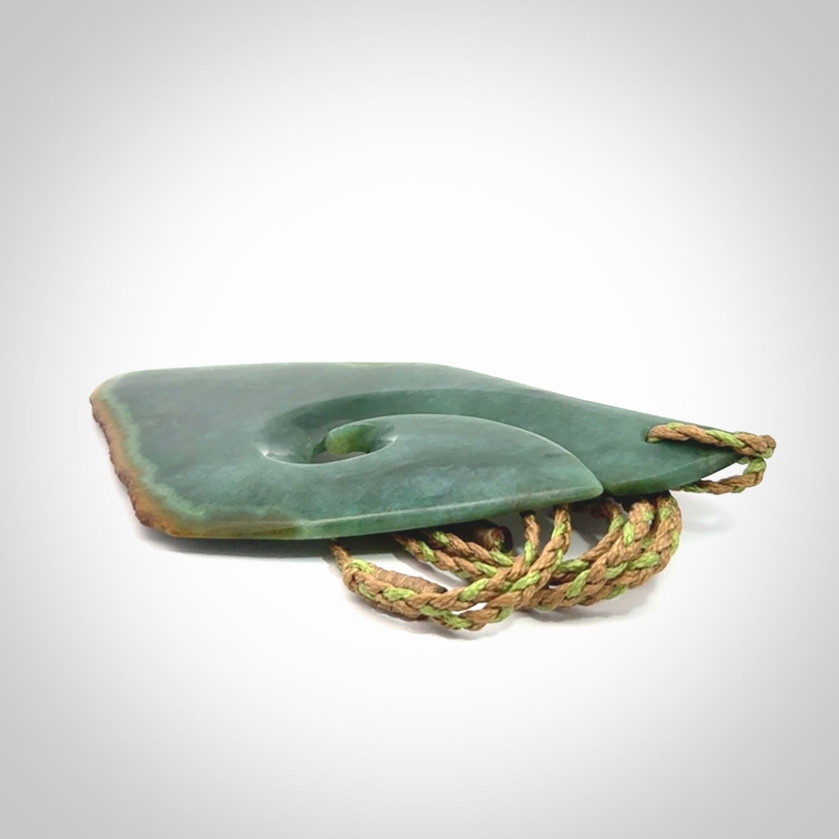 Hand carved New Zealand jade hook, matau pendant.