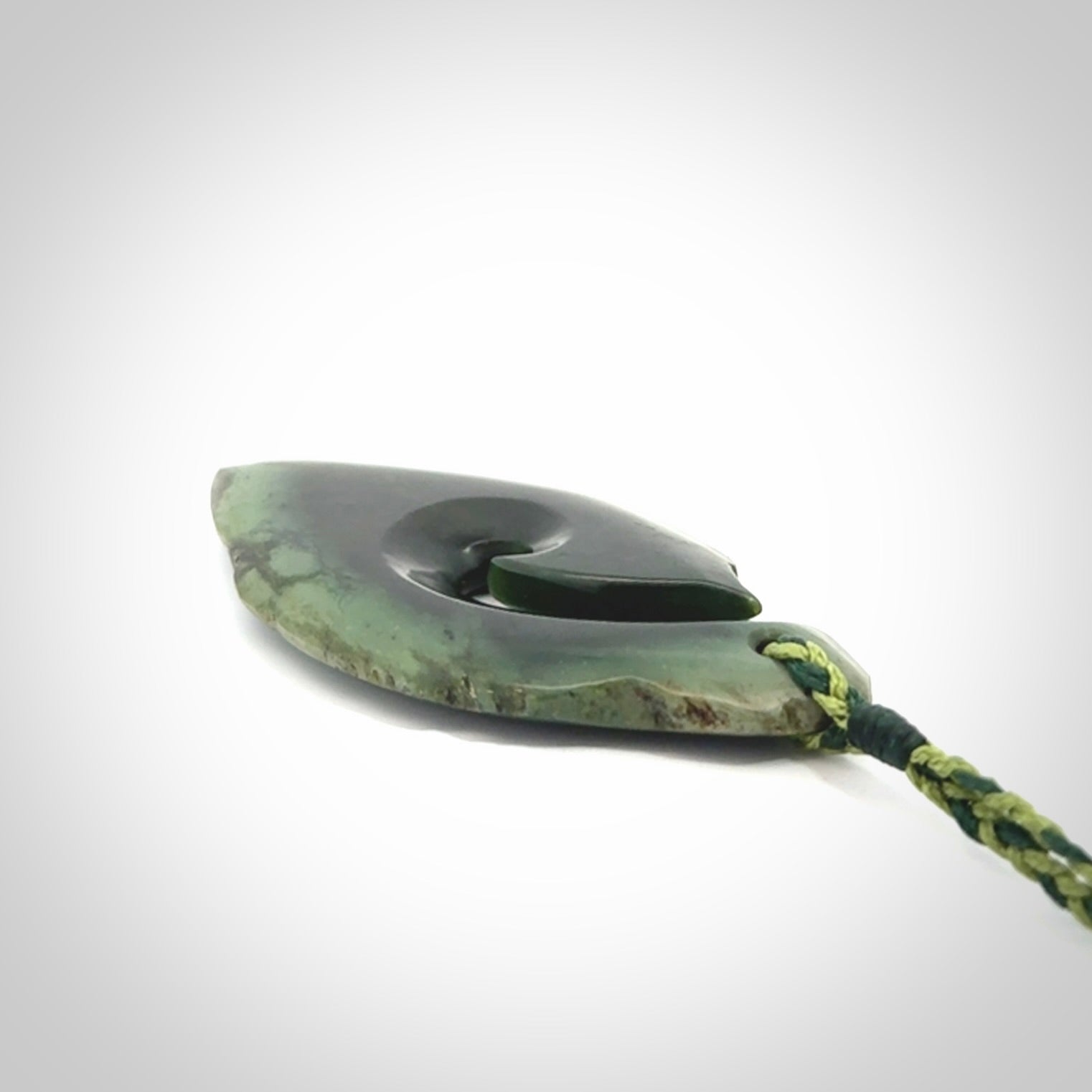 Hand carved New Zealand jade hook, matau pendant.
