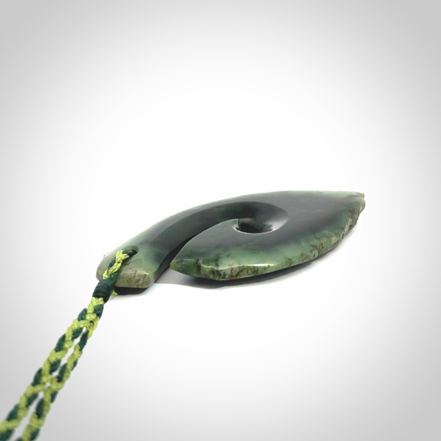 Hand carved New Zealand jade hook, matau pendant.