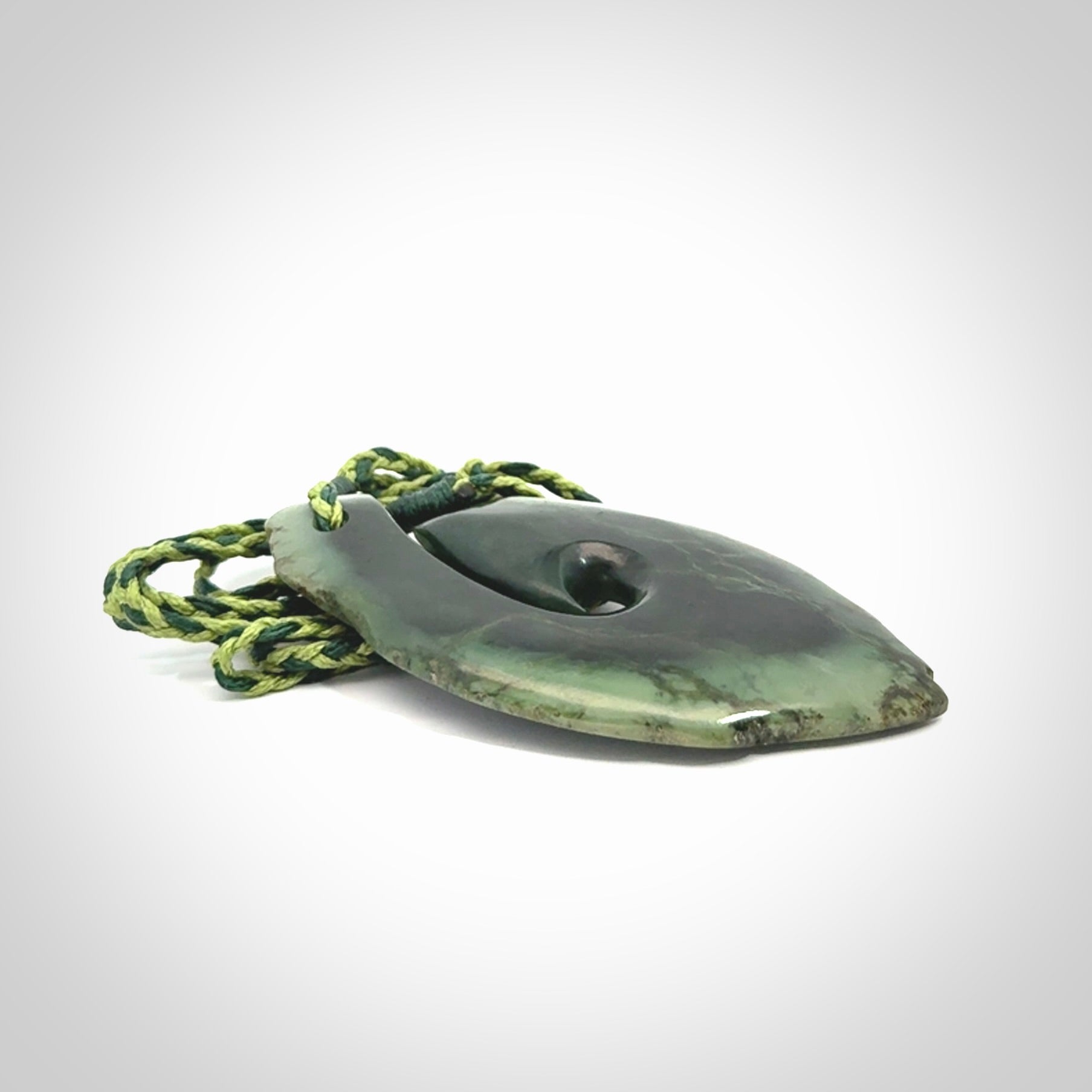 Hand carved New Zealand jade hook, matau pendant.