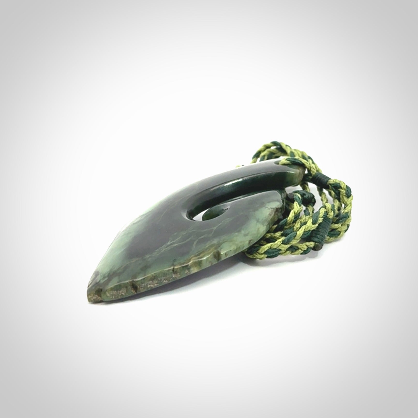 Hand carved New Zealand jade hook, matau pendant.