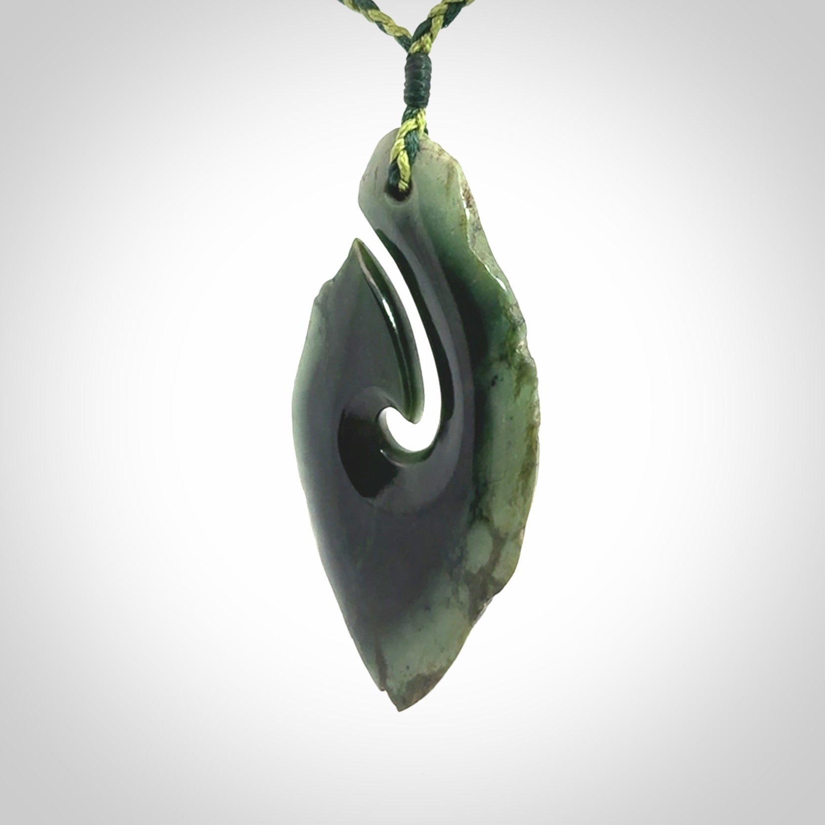 Hand carved New Zealand jade hook, matau pendant.