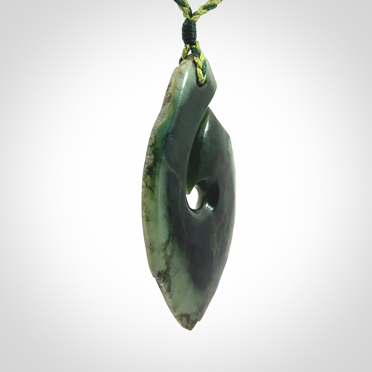 Hand carved New Zealand jade hook, matau pendant.
