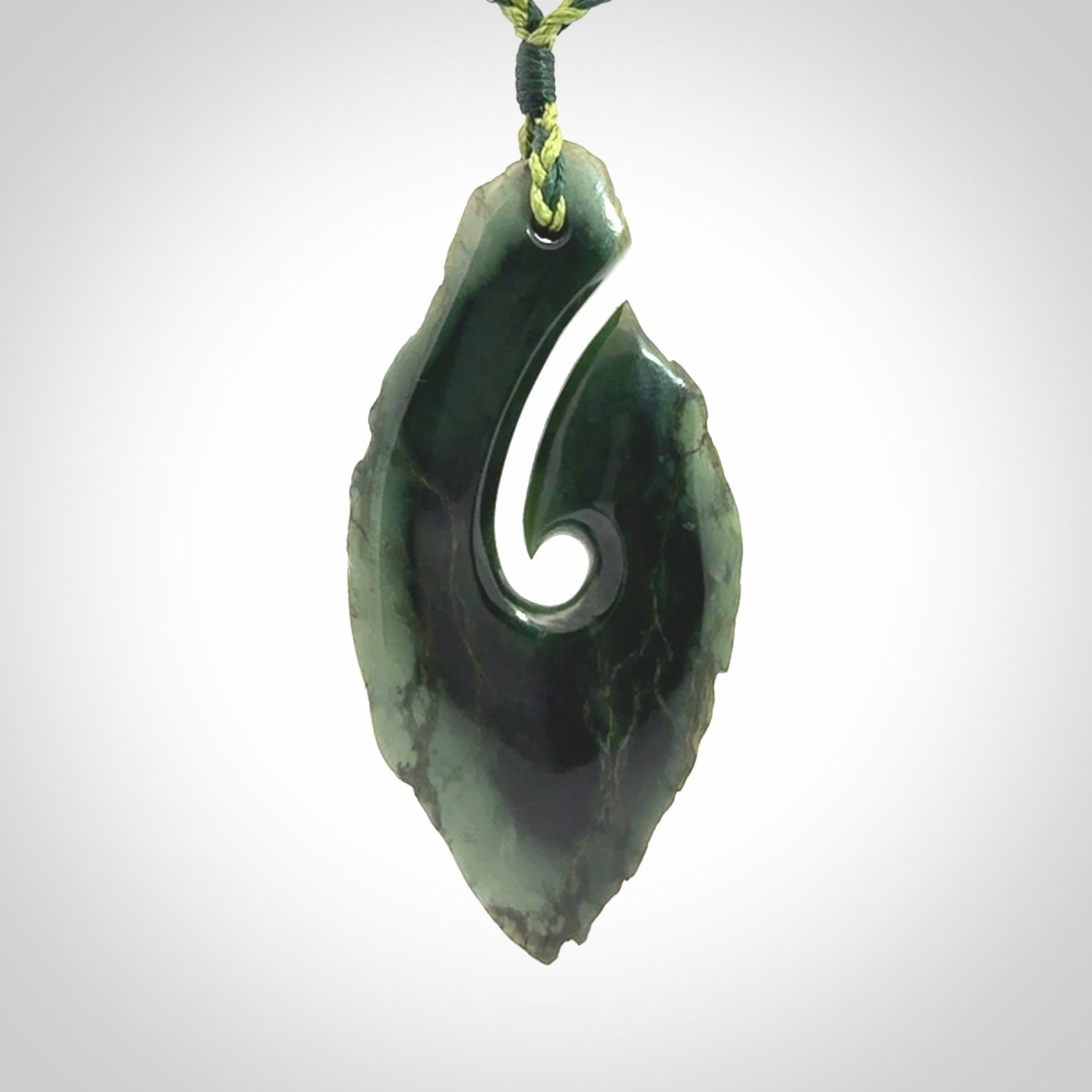 Hand carved New Zealand jade hook, matau pendant.