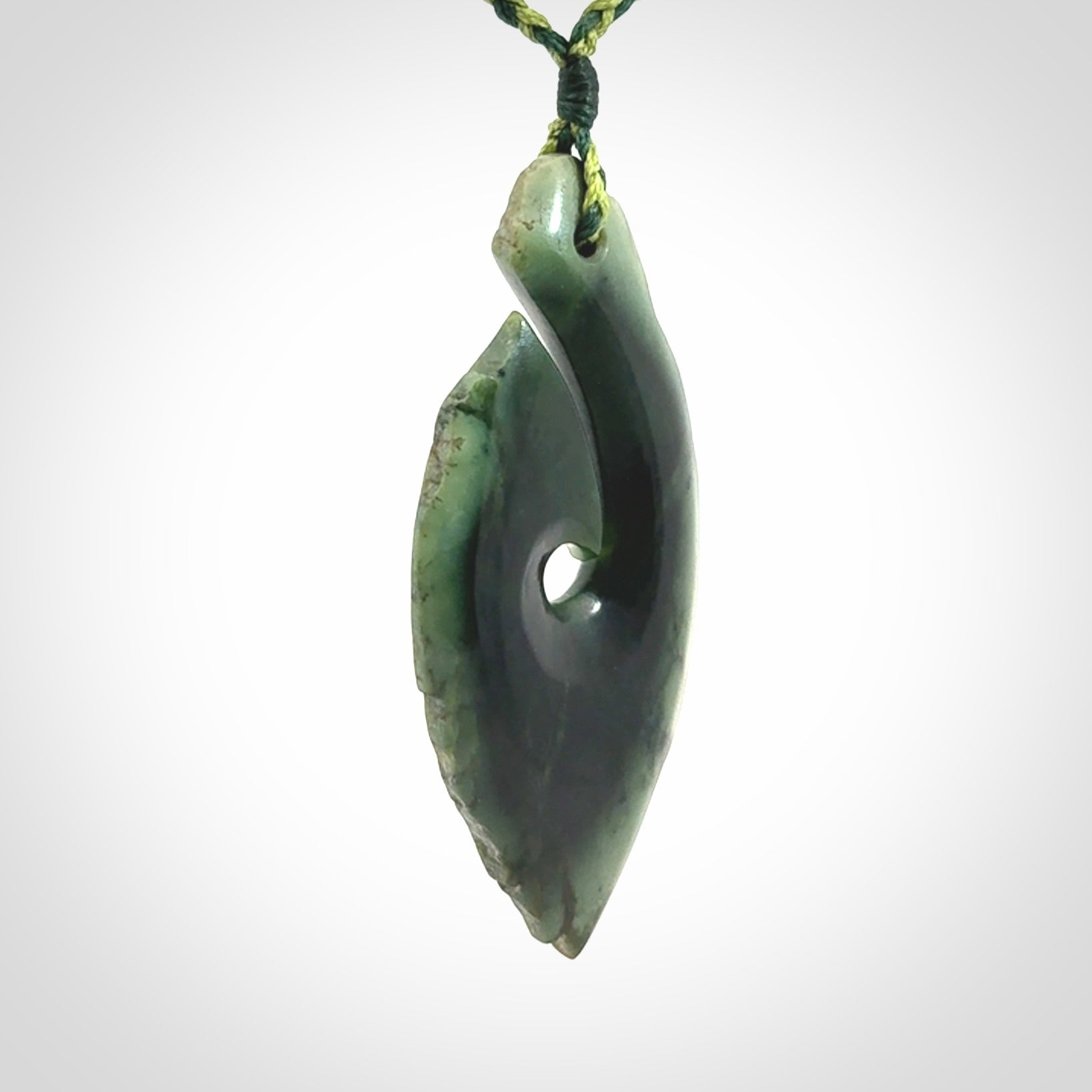 Hand carved New Zealand jade hook, matau pendant.