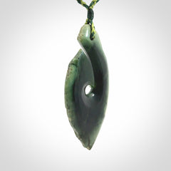 Hand carved New Zealand jade hook, matau pendant.