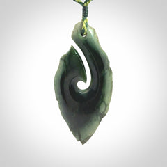 Hand carved New Zealand jade hook, matau pendant.