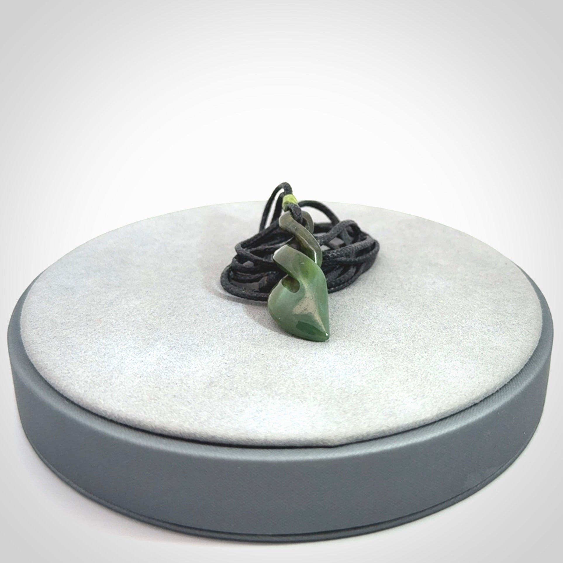 A sublime twist pendant carved in gorgeous jade