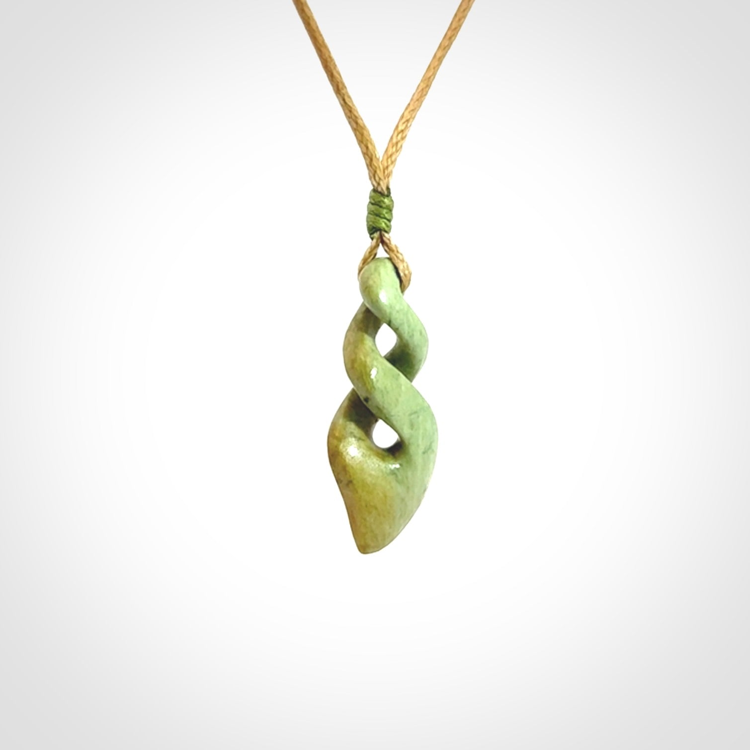 A gorgeous little twist pendant carved in New Zealand Jade