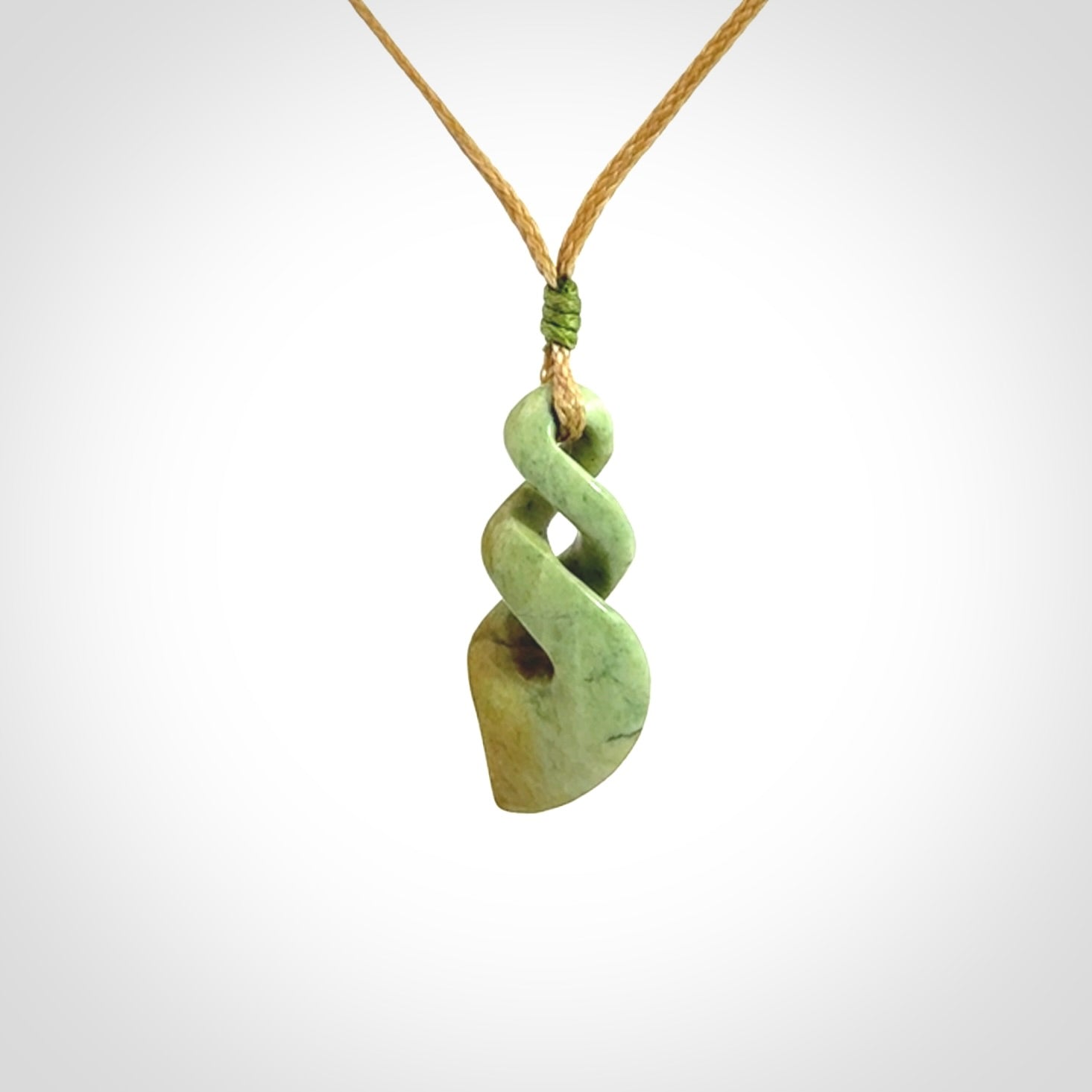 A gorgeous little twist pendant carved in New Zealand Jade