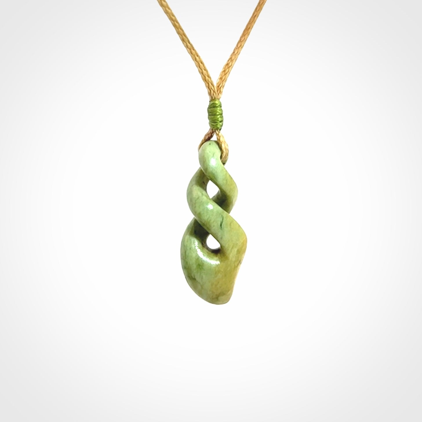 A gorgeous little twist pendant carved in New Zealand Jade