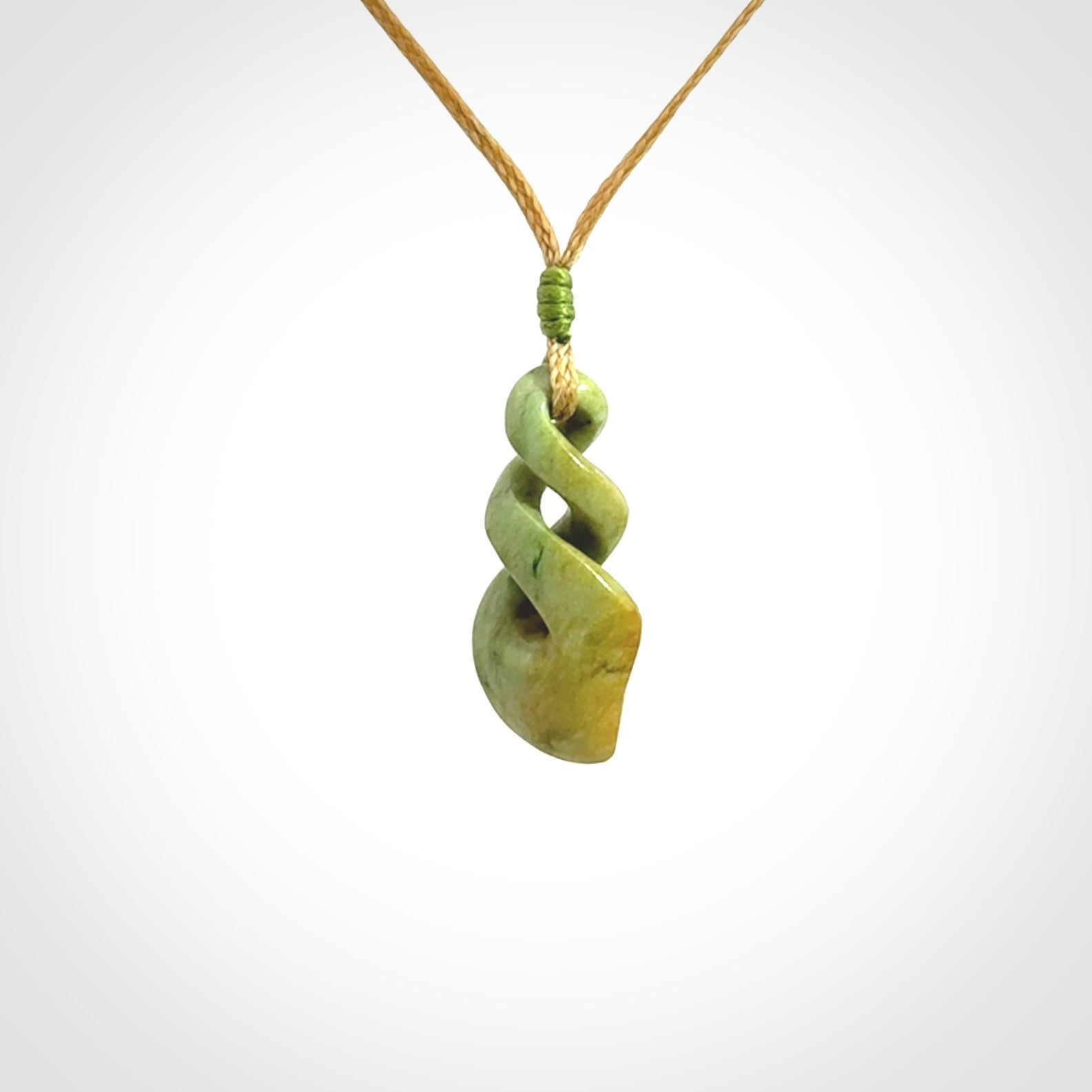 A gorgeous little twist pendant carved in New Zealand Jade