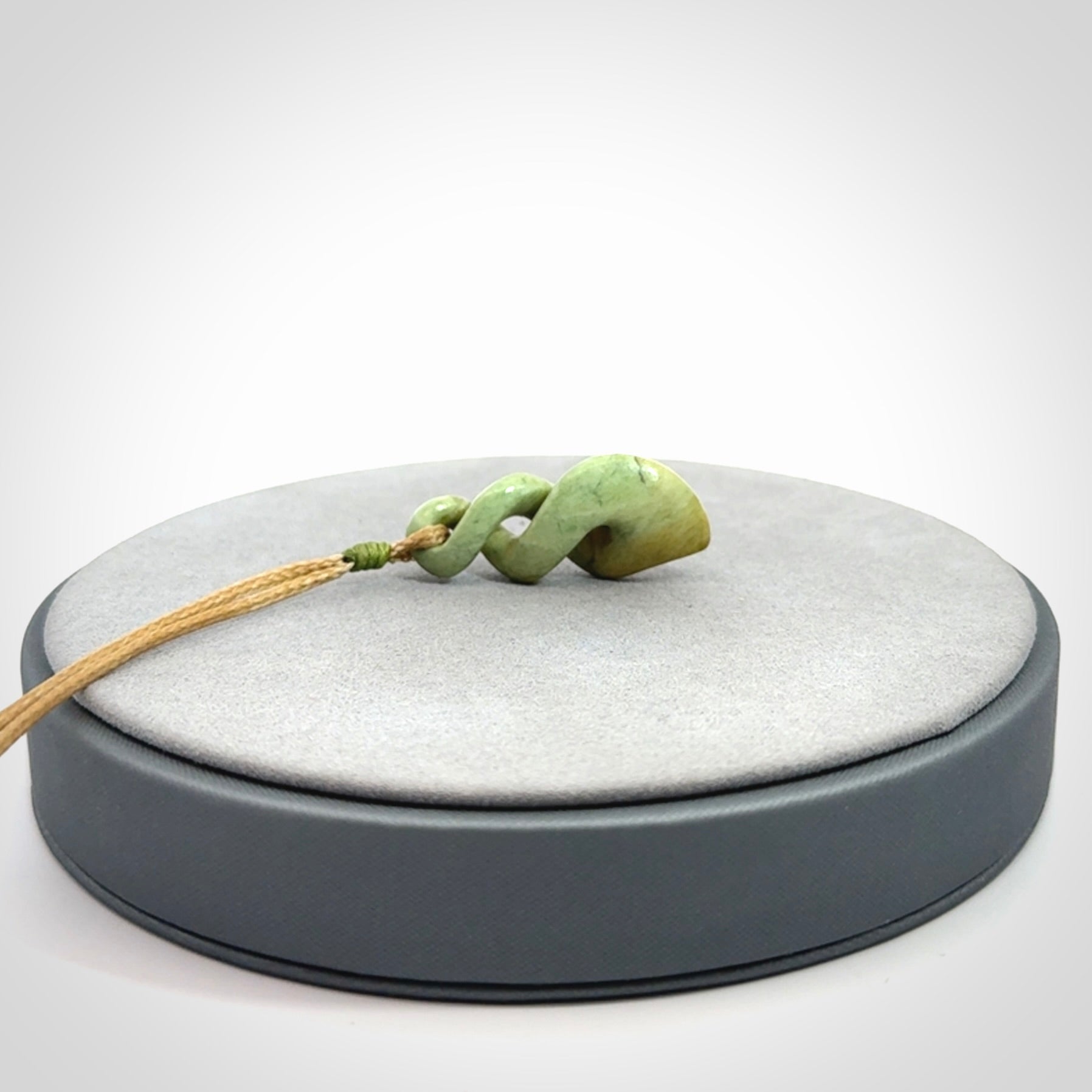 A gorgeous little twist pendant carved in New Zealand Jade