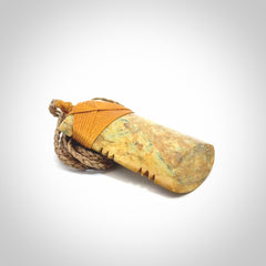 This is a lovely medium sized notched toki pendant made from a gorgeous New Zealand Flower Jade.