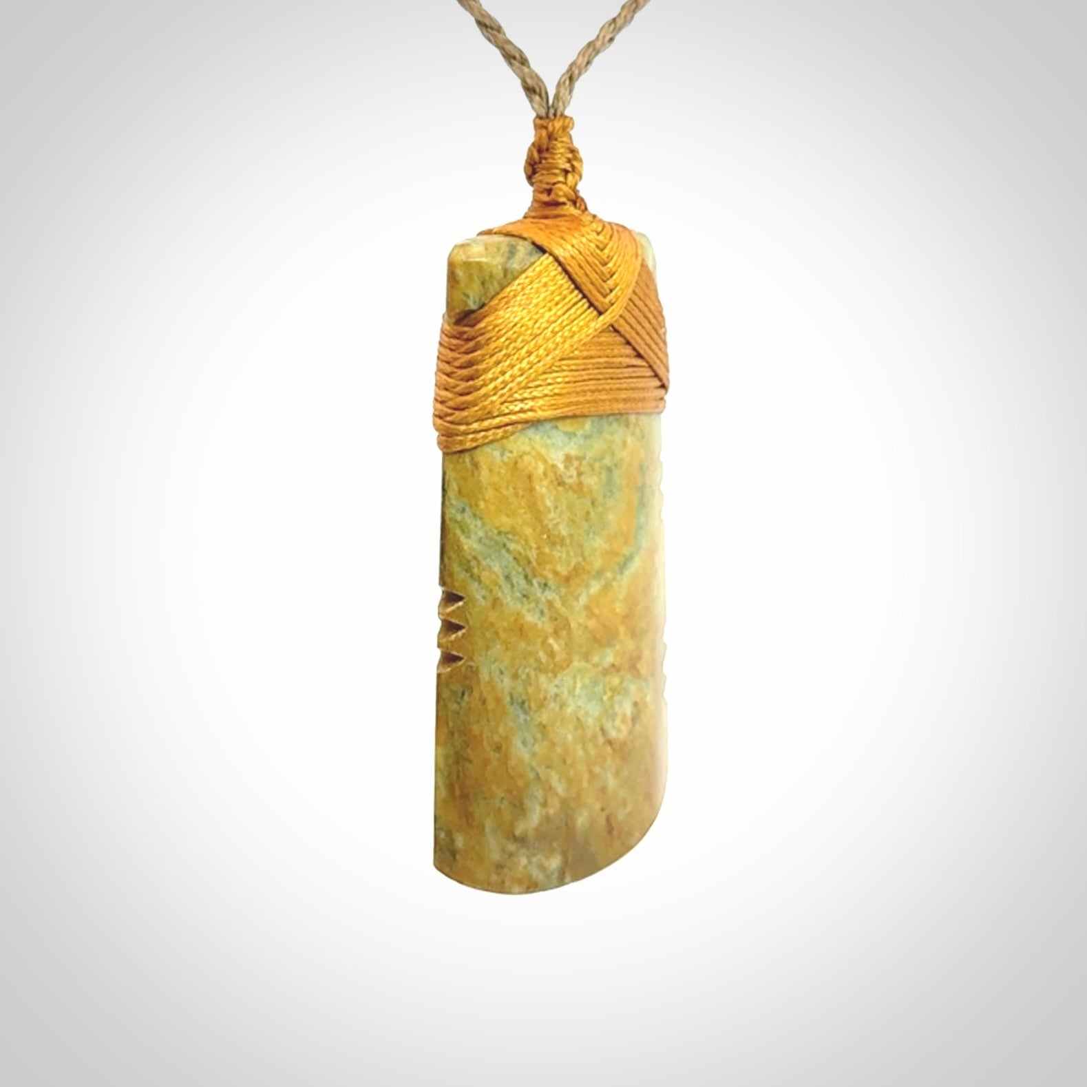 This is a lovely medium sized notched toki pendant made from a gorgeous New Zealand Flower Jade.